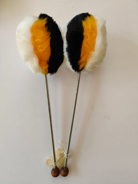 White with yellow and black tenor drum beater